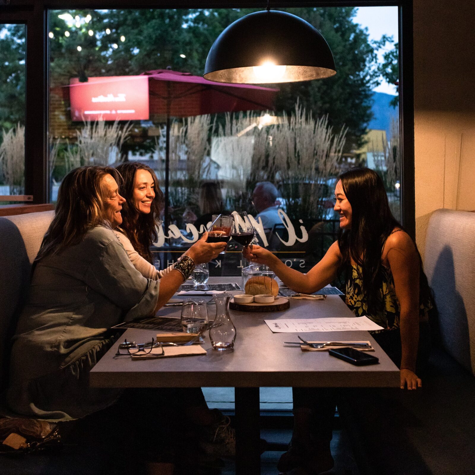 Ladies enjoying delicious food and wine from Mission Hill Winery at il Mercato, Italian West Kelowna restaurants