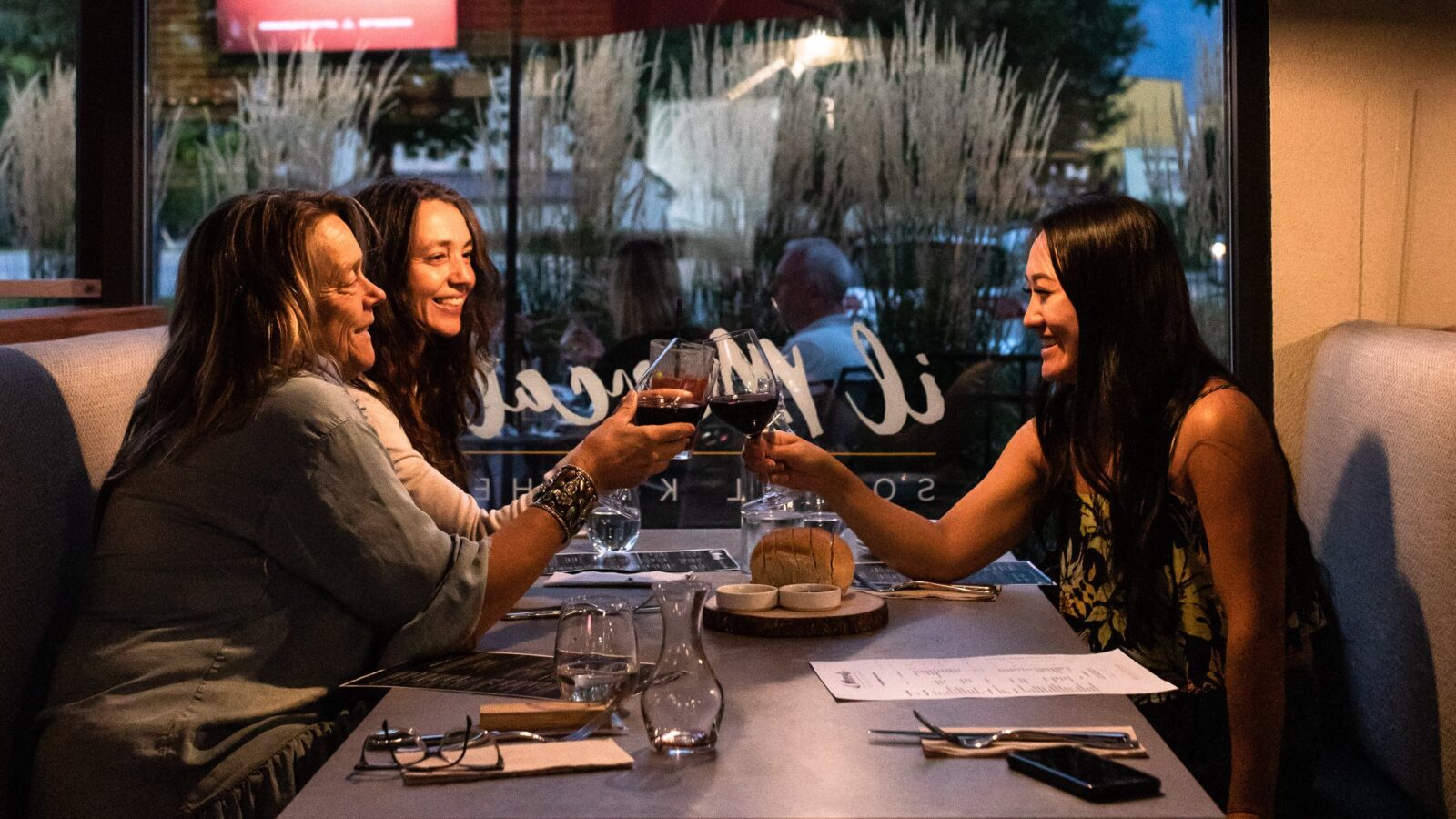 Ladies enjoying delicious food and wine from Mission Hill Winery at il Mercato, Italian West Kelowna restaurants