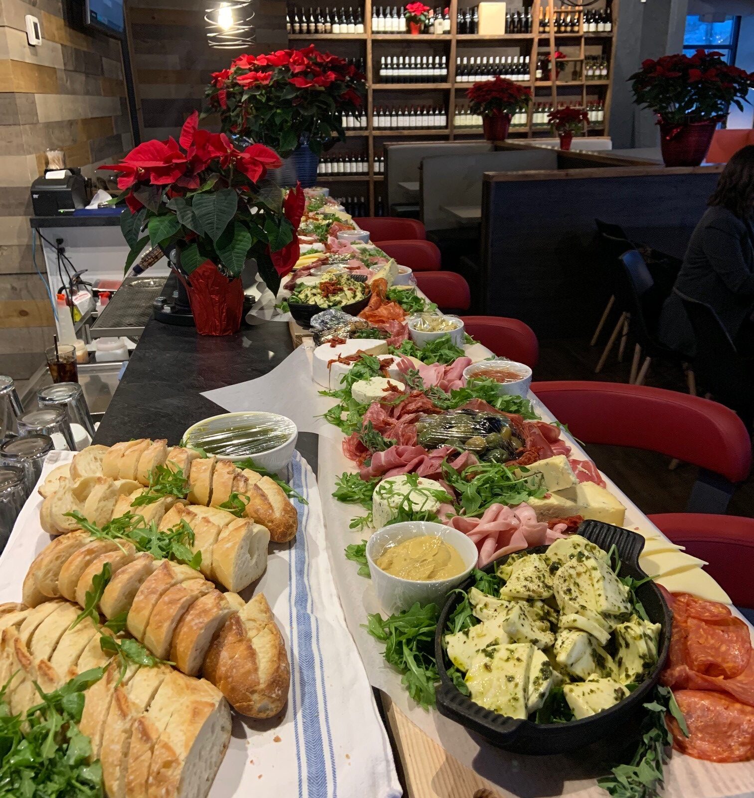 A party-sized charcuterie board prepared with local ingredients in a great atmosphere.