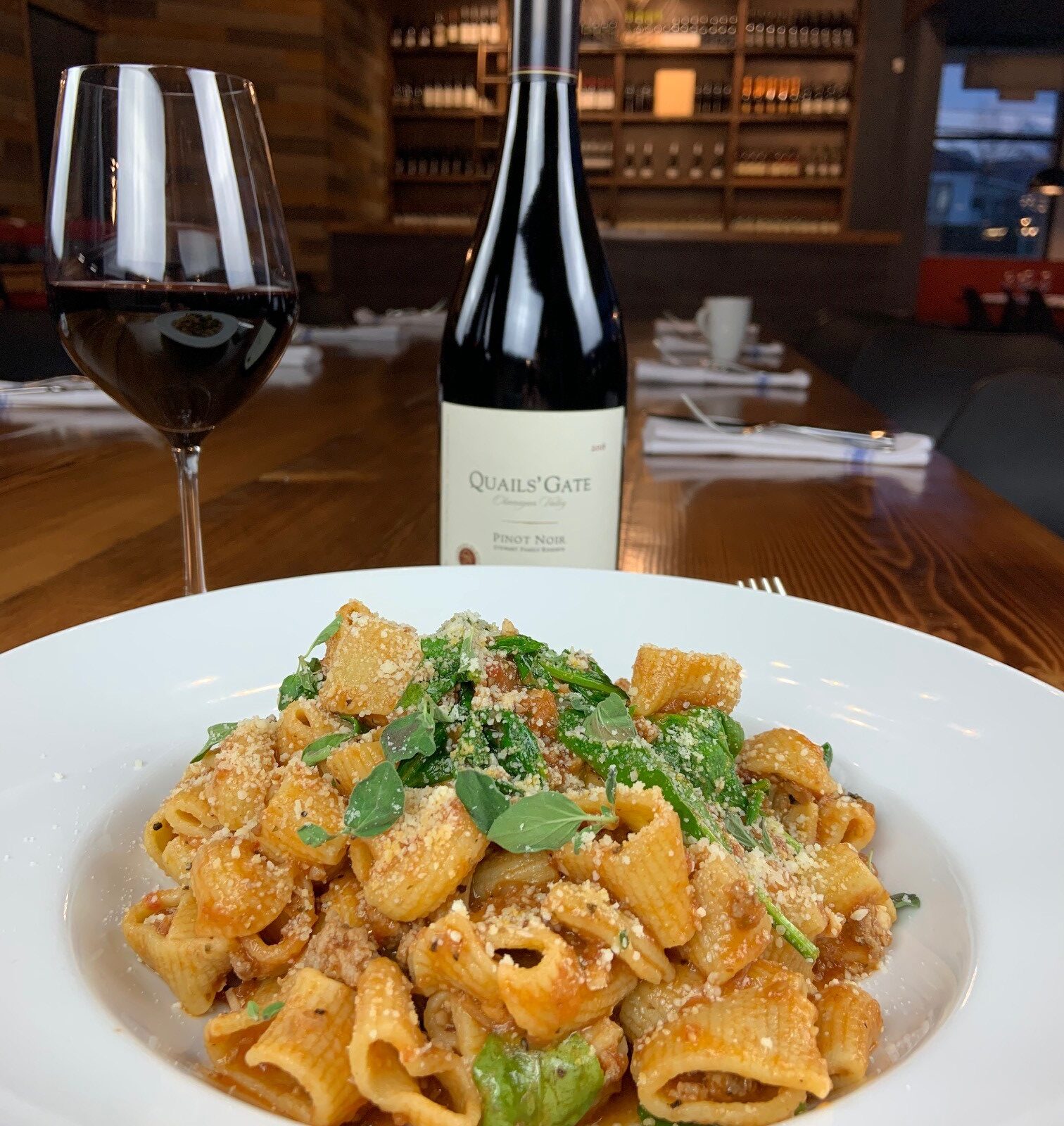 Fresh pasta rigatoni with Quail's Gate Pinot Noir at our traditional themed restaurant